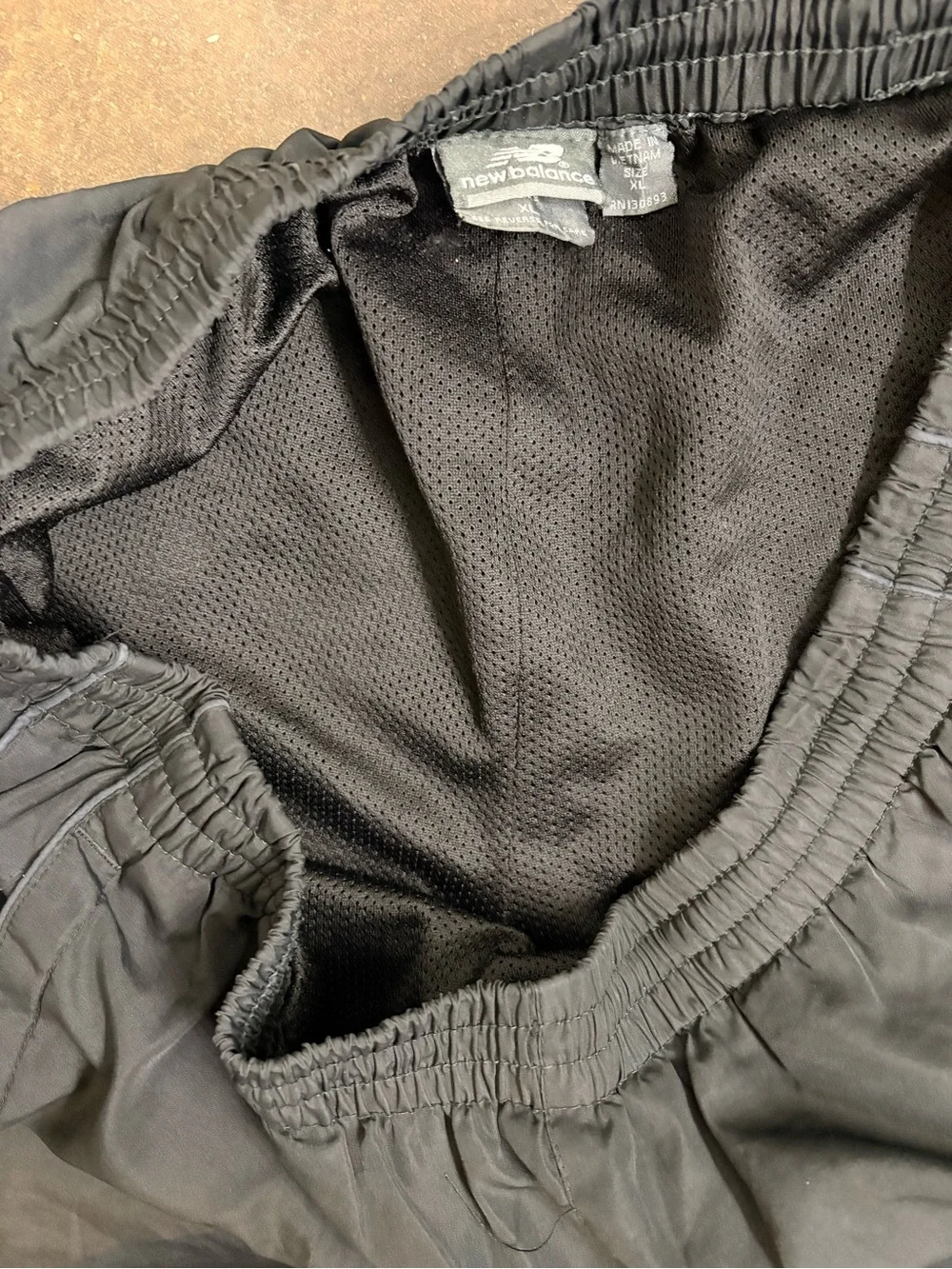 New Balance Men’s Black Track Pants with Zipper Hems